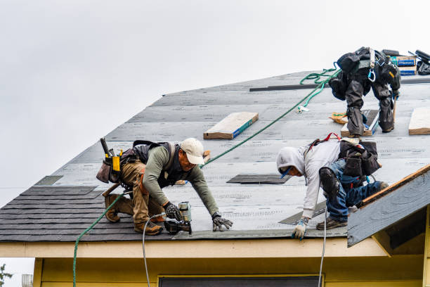 Professional Roofing technician working in Middlebury, VT